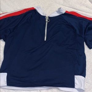 half zipped blue red and white shirt